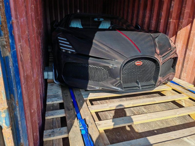 Carbon-fibre Bugatti hypercar inside a shipping container