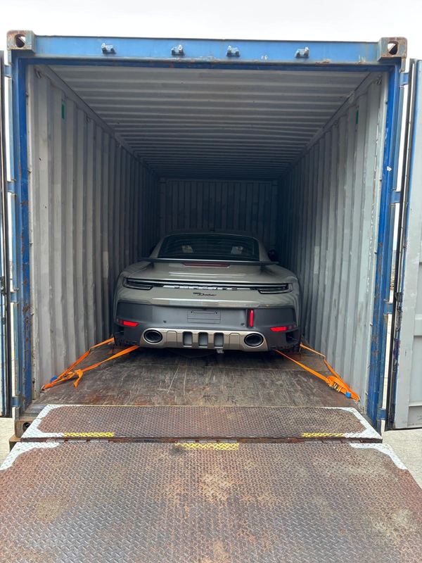 Porsche 911 Dakar strapped inside a shipping container
