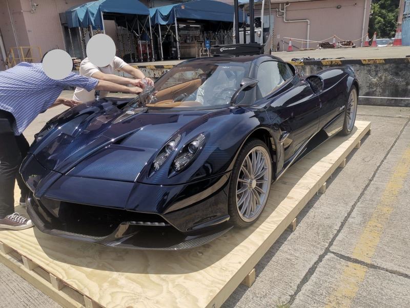 Blue Pagani Huayra on a shipping pallet