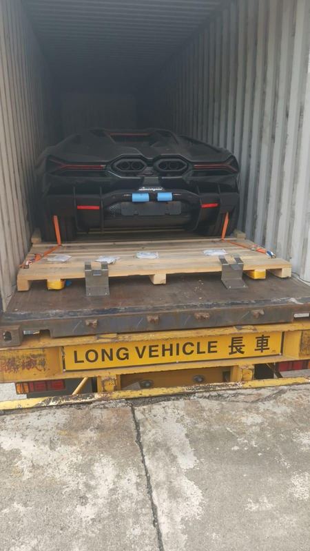 Black Lamborghini Revuelto in a shipping container